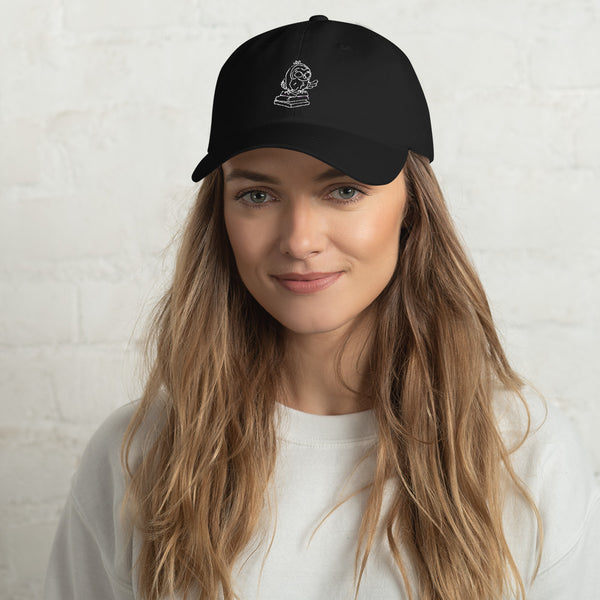 This is our unisex cap in black. It was our barred owl logo in white thread on the front and our company name in white thread on the back. This is the front image.